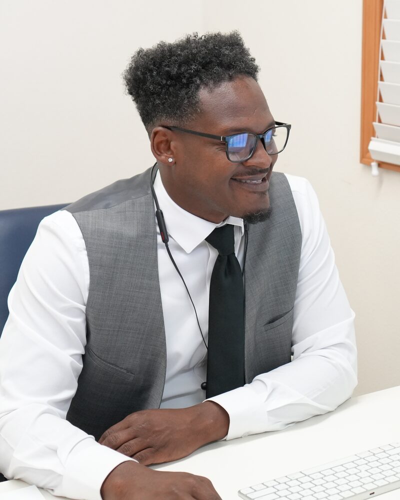 An RVA Edge representative working with a client at his desk
