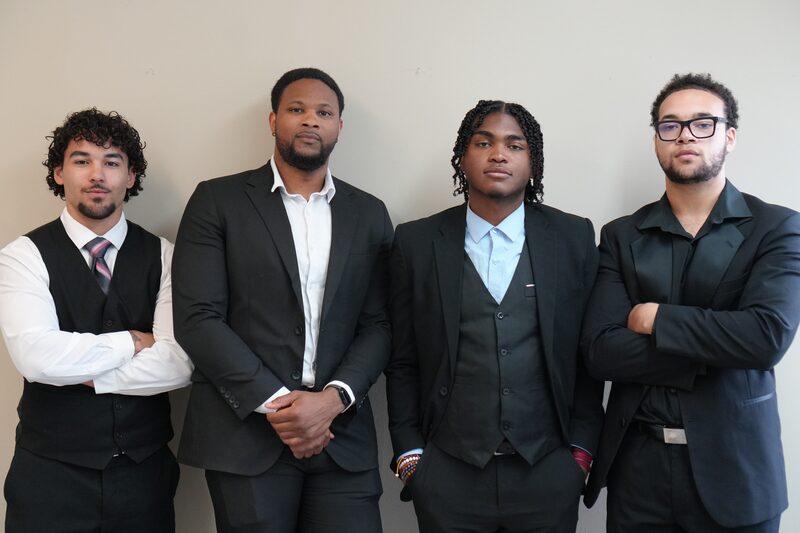 Four members of the RVA Edge team in business attire